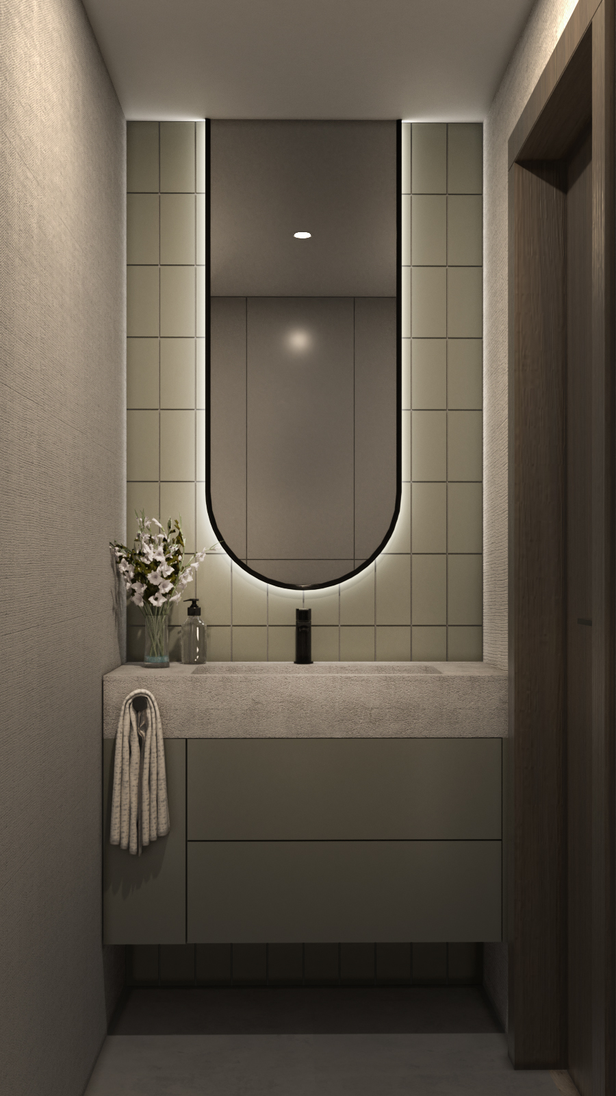 Połączenie głębokiej zieleni płytek z naturalnym kamieniem i monolityczną formą umywalki tworzy detal, który zamienia codzienną czynność w mały, luksusowy rytuał.